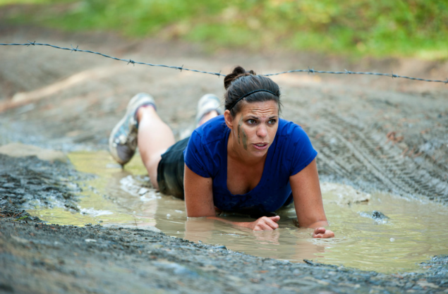 woman racing in mud