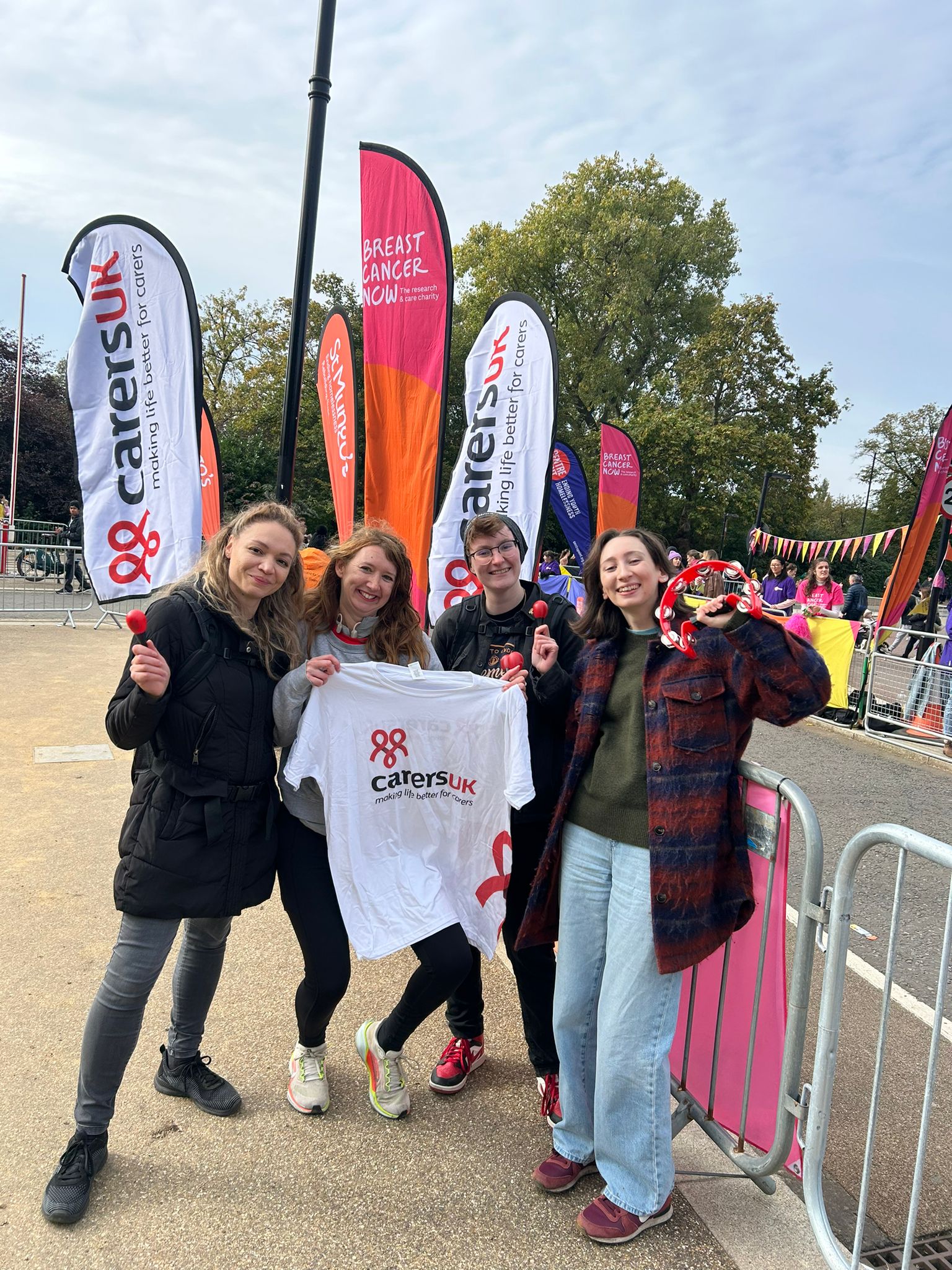 Carers UK staff cheering at the sidelines