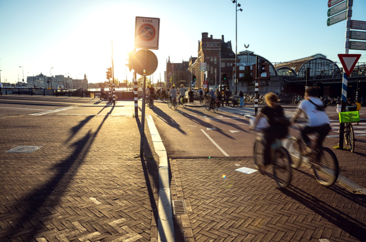 Cyclists through city of Amsterdam