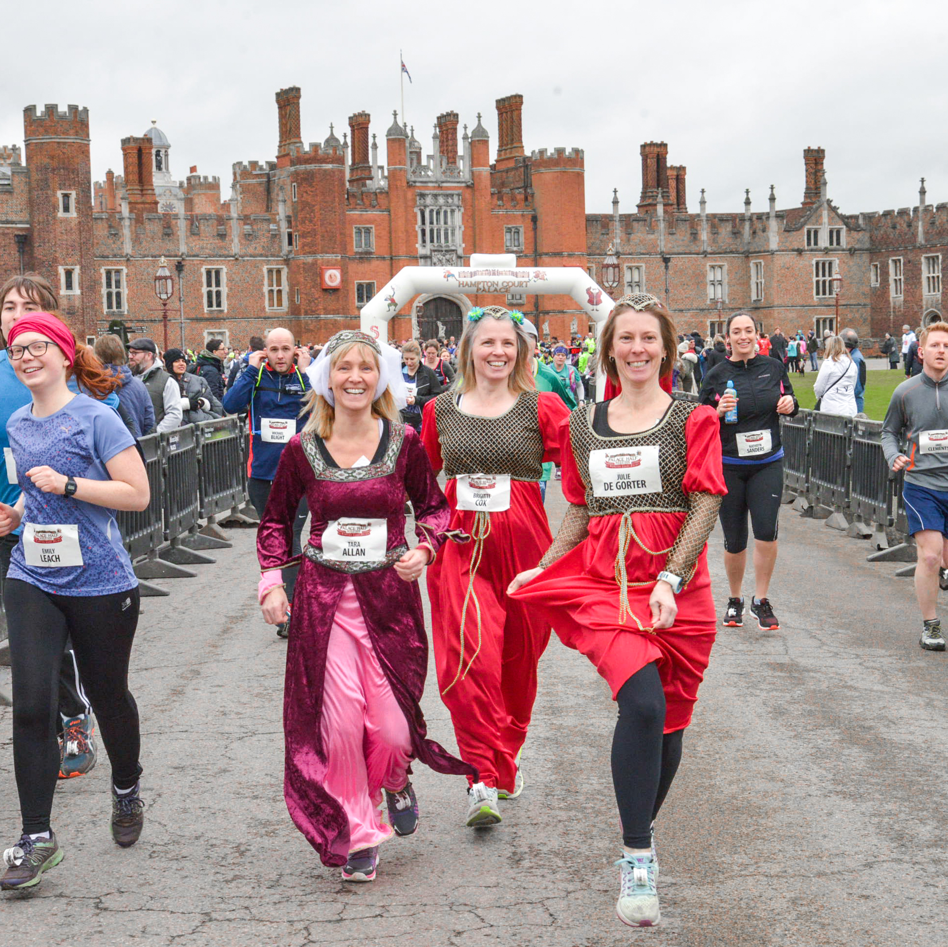 Runners in fancy dress outside Hampton Court Palace