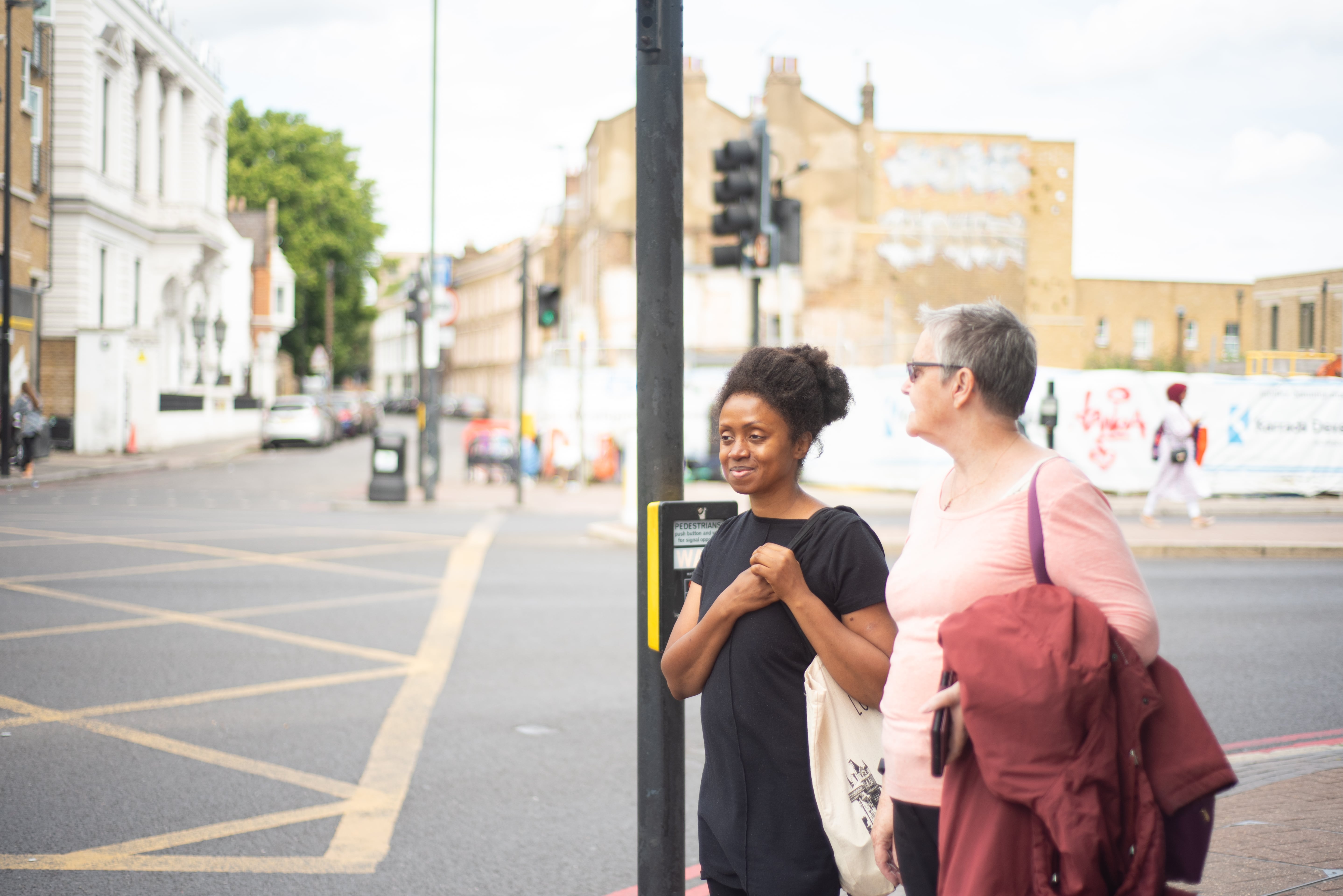 Two ladies crossing the street