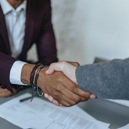 two people shaking hands