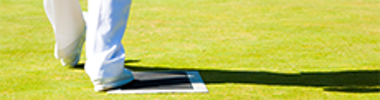man playing bowls on a green